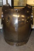 A French Cuirassier’s breast plate, the steel body with raised medial ridge and flared skirt.