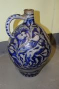 A late 19th Century German pottery large Westerwald wine flagon, with incised decoration.