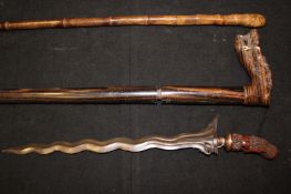 A sword stick, 68.5cm square section blade, contained in its bamboo case, together with another