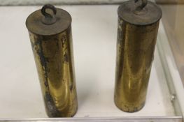 A pair of 19th Century brass cased lead filled longcase clock weights. (2)