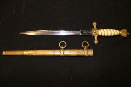 A Third Reich Naval Officer’s dagger, 24cm double fullered blade by WKC etched with naval motifs,