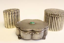 An Italian silver box of shaped outline, the lid with malachite inset cabochon, with gilt interior