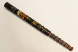 A painted wood truncheon, the black body with gilt P. and 7., plain turned wood ribbed grip. A