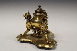 A 19th Century gilt brass desk inkstand, with griffin supports.