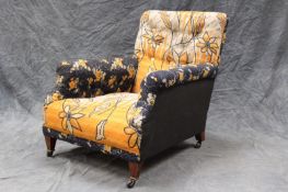 A late 19th/early 20th Century deep seated button back armchair, upholstered in quilted rali