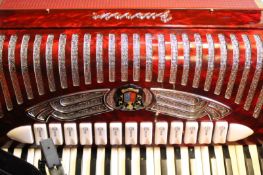 A Guerini accordion, in fitted travelling case.