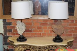 A pair of table lamps, each mounted with mineral specimens.