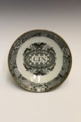 A George III pearlware footed gin bowl, with black printed decoration of floral, scroll and