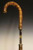 A blued and gilt sword stick, 69.5cm single fullered blade etched with scrolling foliage and TOLEDO,