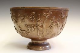 An early 19th Century glazed stoneware footed bowl, decorated in semi relief with Satan using his