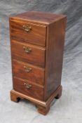 A George III style narrow mahogany chest of four drawers, on bracket feet, 44cm wide.