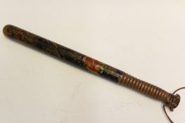 A Victorian painted Police truncheon, decorated with a crown over VR in red, gold and green paint,