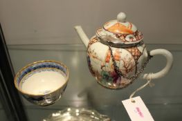 An 18th Century Chinese globular teapot and cover, decorated in coloured enamels with panels of a