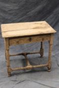 An 18th Century carved oak side table, with frieze drawer on turned bobbin supports and