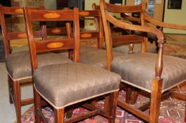 A matched set of six George IV mahogany and inlaid country made dining chairs, comprising four