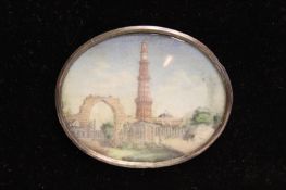 A 19th Century Indian miniature watercolour on ivory of the Taj Mahal, 7.5 x 11cm oval, in carved