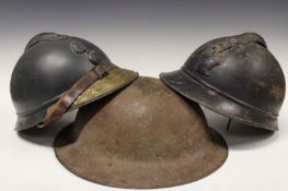 A First World War British tin hat, brown textured painted steel skull with turned brim, hessian