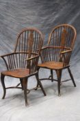 A pair of Windsor wheelback armchairs, shaped seats, and crinoline stretchers. (2)