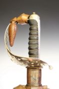 An 1887 Pattern Heavy Cavalry Officer’s Undress sword, 81cm blade etched with scrolling foliage