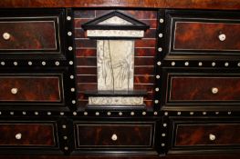 A 17th/18th Century walnut and ivory inlaid table cabinet, with an arrangement of eight drawers,