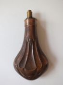 An Hawksley embossed copper powder flask, of pear form and decorated with stylised acanthus