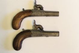 A pair of percussion rounded action muff pistols by Bulman, 1.25 inch turn-off barrels, engraved