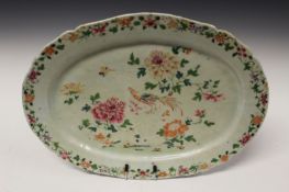 A Chinese export famille rose oval platter, with shaped rim, decorated with birds and flowers,