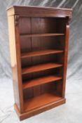 A Victorian mahogany open bookcase, fitted with four adjustable shelves, on plinth base, 176cm