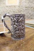 A Chinese silver mug by Wang Hing, cast profusely with fantastic birds amidst blossoming branches,