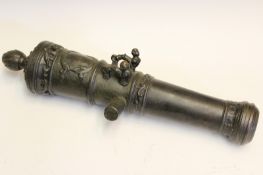 A North European style bronze cannon barrel, 18 inch five stage barrel cast in relief with scrolling