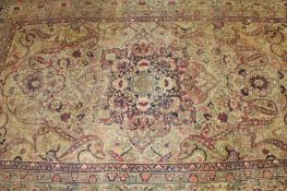 A Persian Kirman room size carpet.