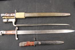 An American Remington bayonet, complete with scabbard and canvas frog, together with a British knife