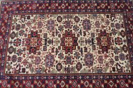 An Oriental rug of Caucasian design, 204 x 139cm.