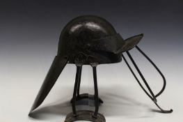 A rare shoulder braced English Civil War lobster tailed helmet, the crude two piece blackened