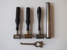 A brass cartridge extractor, together with three combination shot and powder measures and an oil