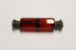 A silver topped ruby glass double ended scent bottle.