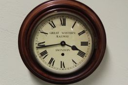 An eight day wall clock, with 7 1/2 inch dial, marked Great Western Railway, Swindon.