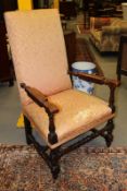 An Flemish walnut high back armchair, with baluster turned arms and stretchered legs.