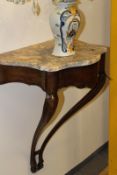 A small console table, with marble top above shaped frieze and slender supports, 52cm wide.