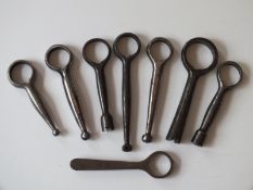 Eight various steel pistol barrel keys, for varying barrel diameters, three with combined nipple