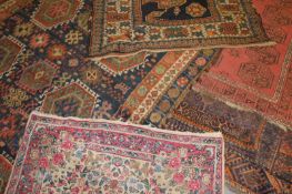 A group of five Oriental rugs, to include Persian, Belouch and Afghan examples. (5)