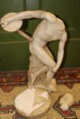 A marble statue of The Discus Thrower, after the antique, 63cm high approx. (a/f).