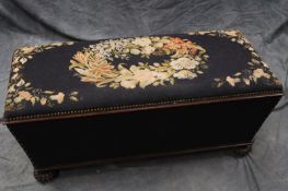 A Victorian sarcophagus form box ottoman, with needle point upholstery, 118cm wide.