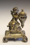 A 19th Century silver plated brass inkwell, in the form of a winged putto holding an urn and