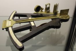An early 19th Century ebony octant, unsigned, brass fittings and engraved ivory scale, (lacking some