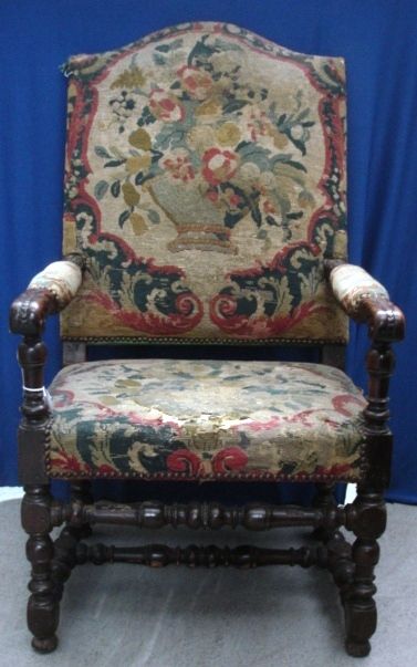 C18th Oak Armchair, high domed back with tapestry cover & seat, arms with leaf carved decoration,