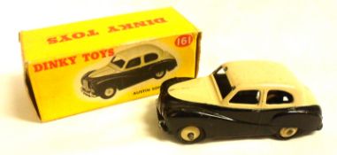 DINKY TOYS NO 161, a slightly playworn (a few small chips) boxed Black and Cream Austin Somerset