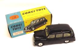 CORGI TOYS NO 418, a very good boxed Black Austin London FX4 Taxi with flat hubs and the issue
