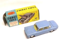 CORGI TOYS NO 229, a slightly faded boxed Light Blue Chevrolet Corvair Sedan with flat hubs, in a