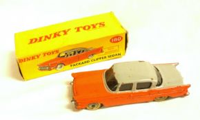 DINKY TOYS NO 180, a slightly playworn (a few chips) boxed Grey and Orange Packard Clipper Sedan (